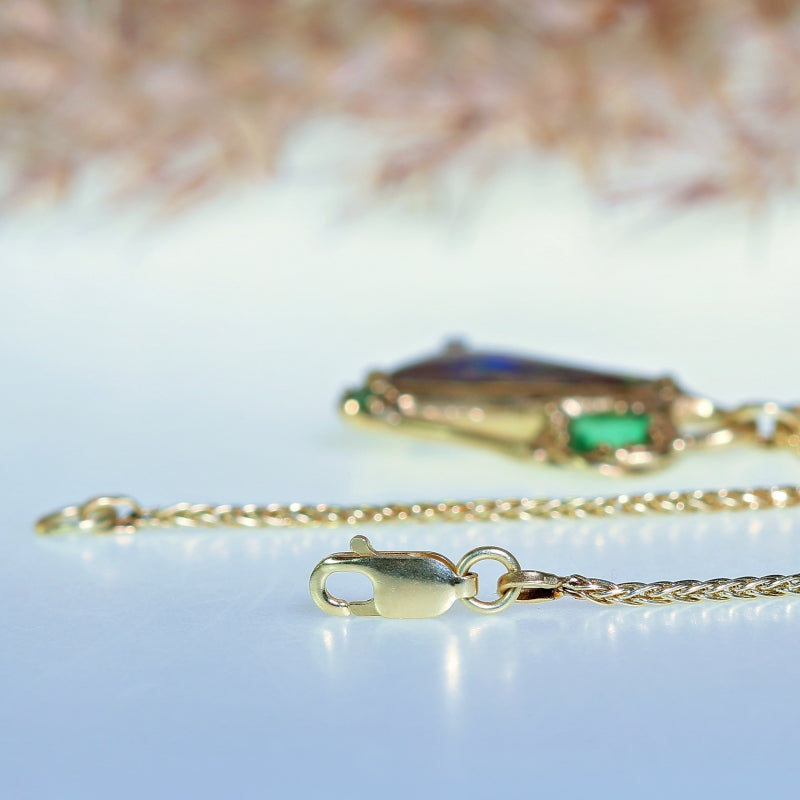 Gold necklace with “crazy” Boulder opal and emerals