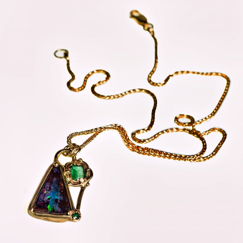 Gold necklace with “crazy” Boulder opal and emerals