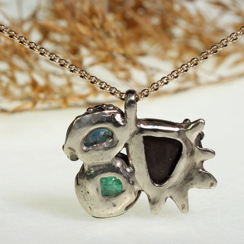 White gold necklace with opal, sapphire and emerald