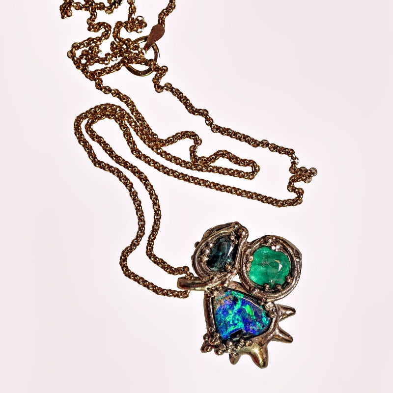 White gold necklace with opal, sapphire and emerald