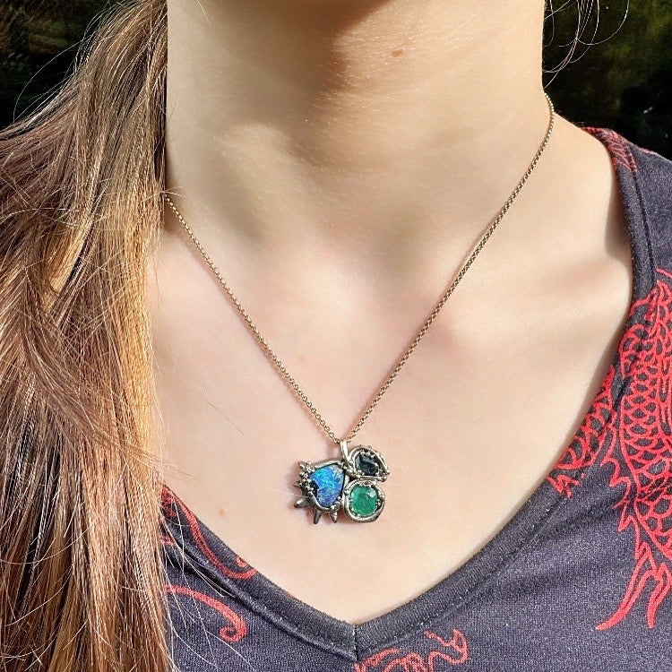 White gold necklace with opal, sapphire and emerald