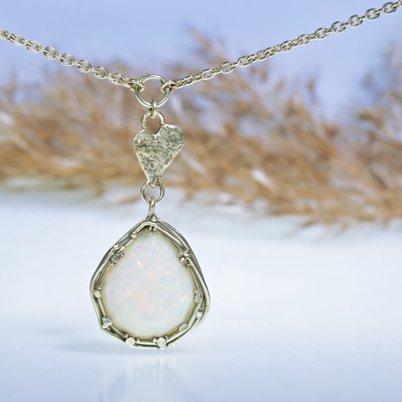 Gold necklace with big opal and heart