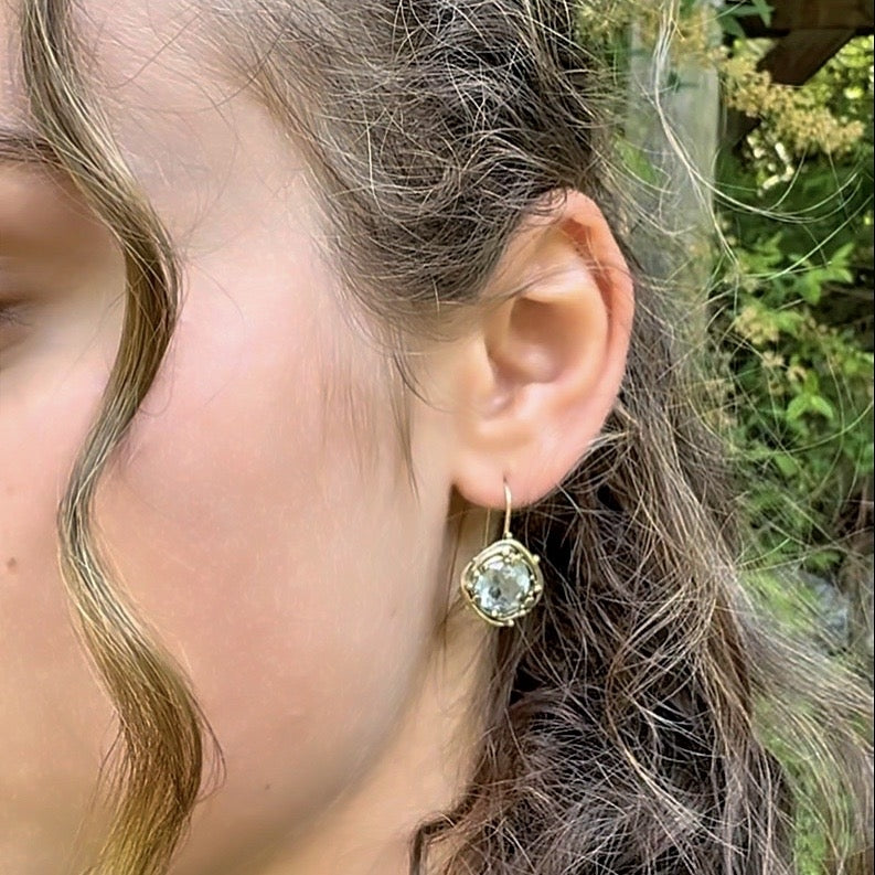 Gold earrings with mandala cut aquamarines