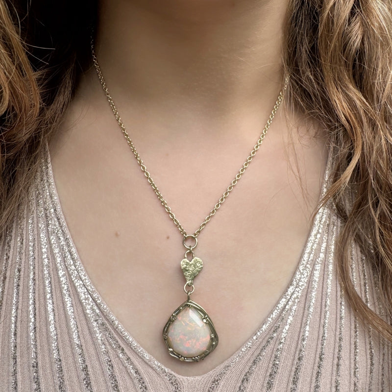 Gold necklace with big opal and heart