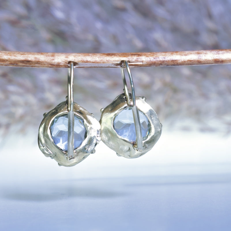 Gold earrings with mandala cut aquamarines