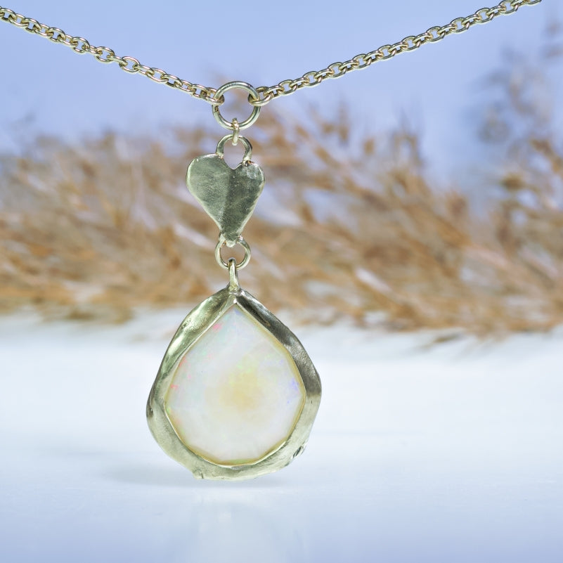 Gold necklace with big opal and heart