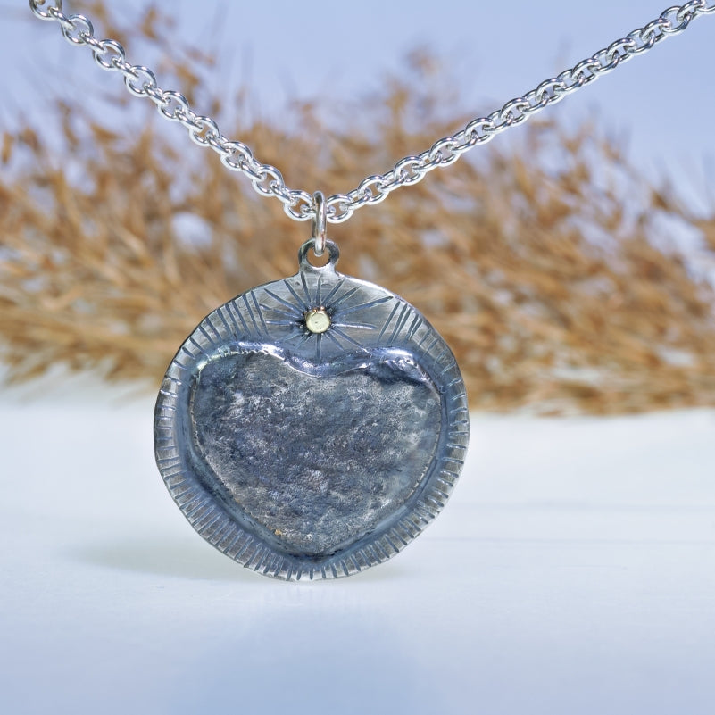 Big Heart round amulet