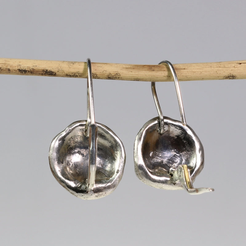 Round simply metals earrings with three gold dots