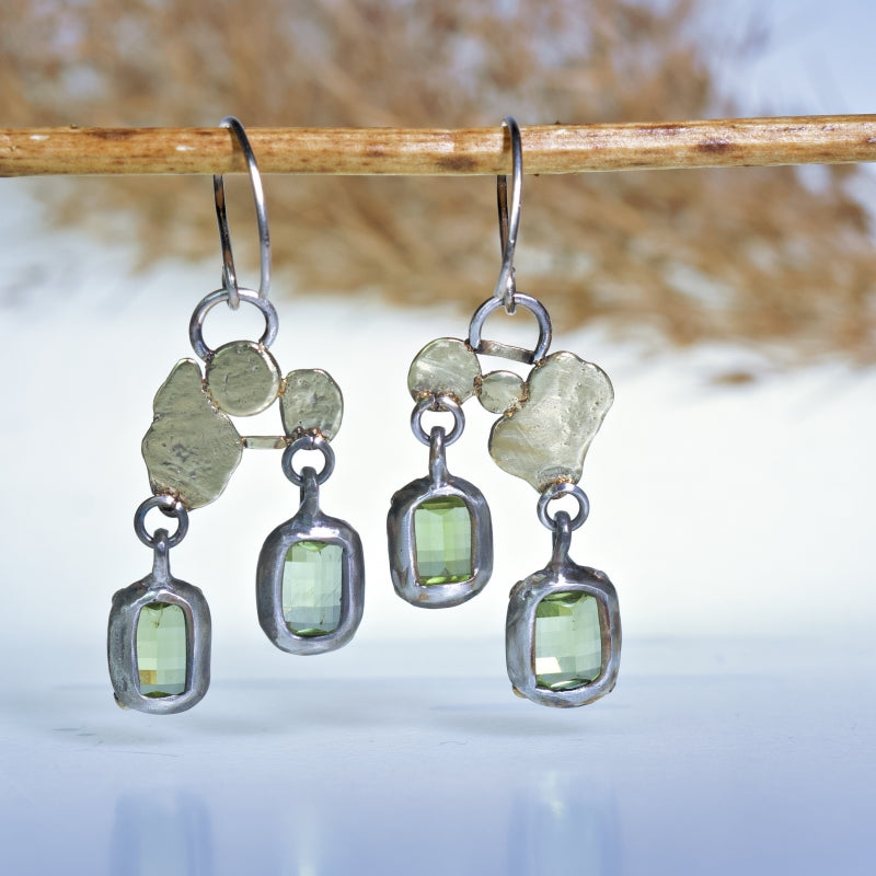 Hanging earrings with pixel cut peridots