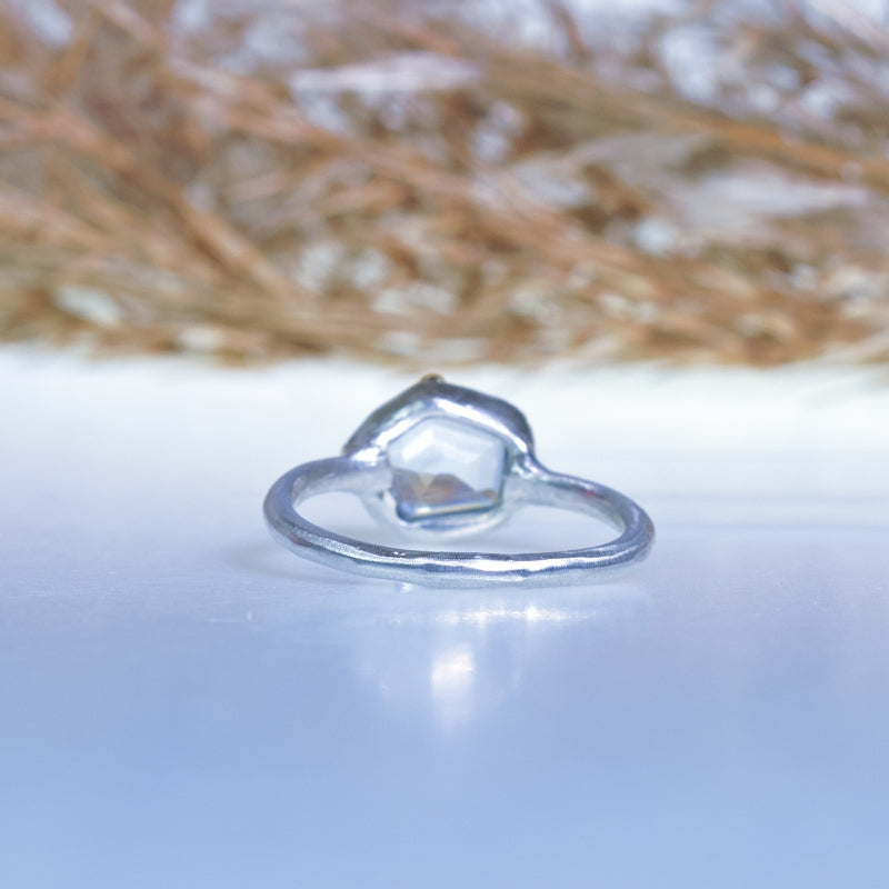 Tiny ring with geometric cut aquamarine