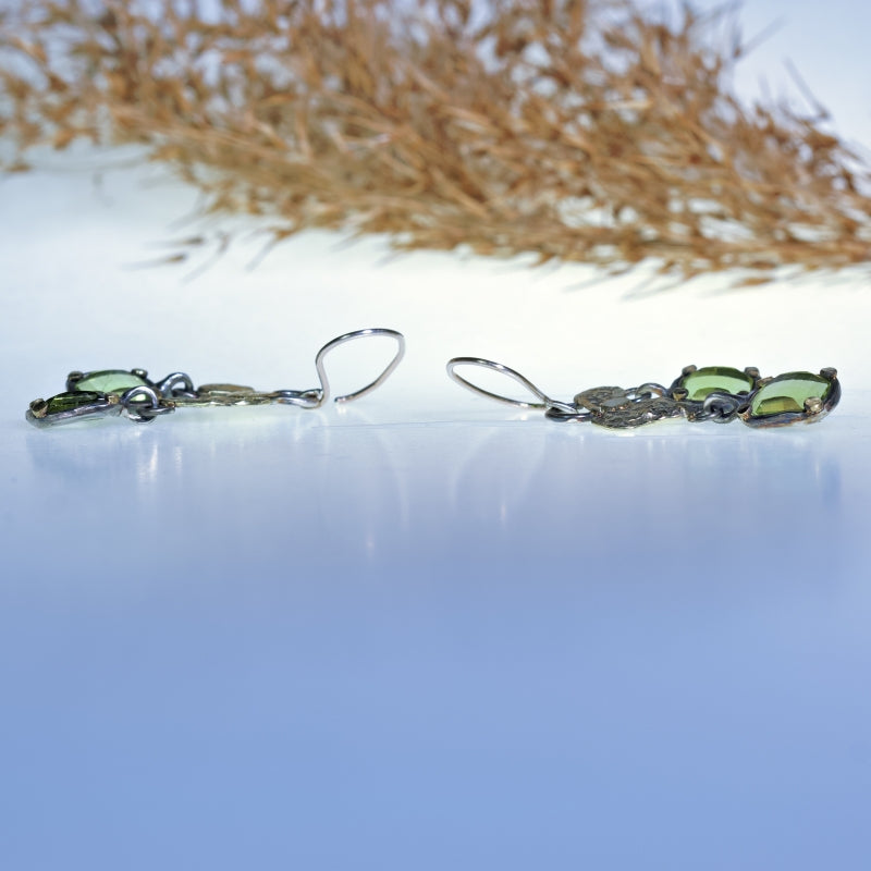 Hanging earrings with pixel cut peridots