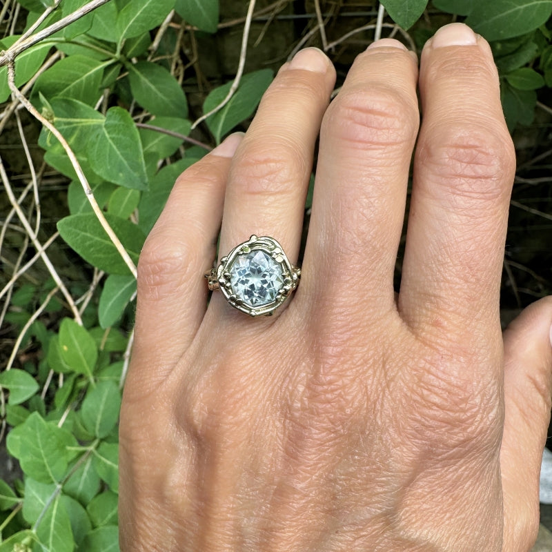 Gold ring with aquamarine in mandala cut