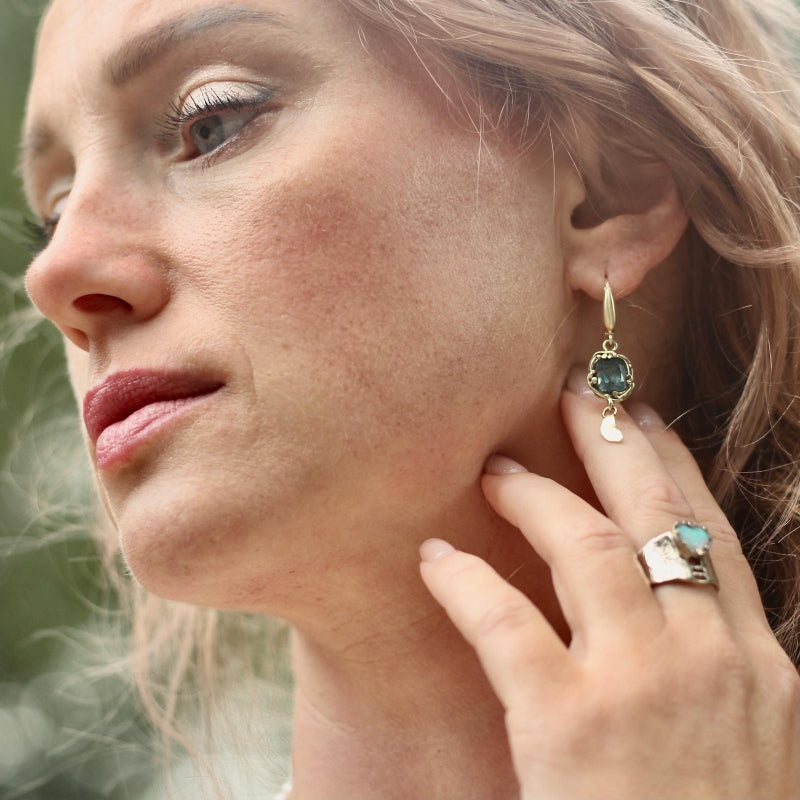 Gold earrings with sky blue tourmalines