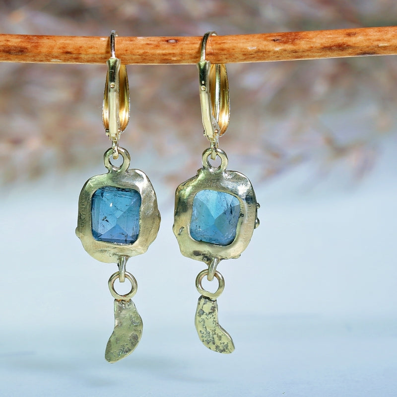 Gold earrings with sky blue tourmalines