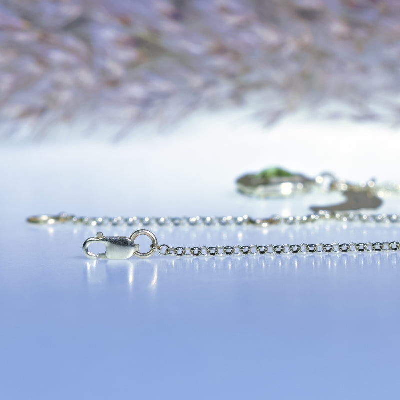 Gold necklace with peridot and halfmoon