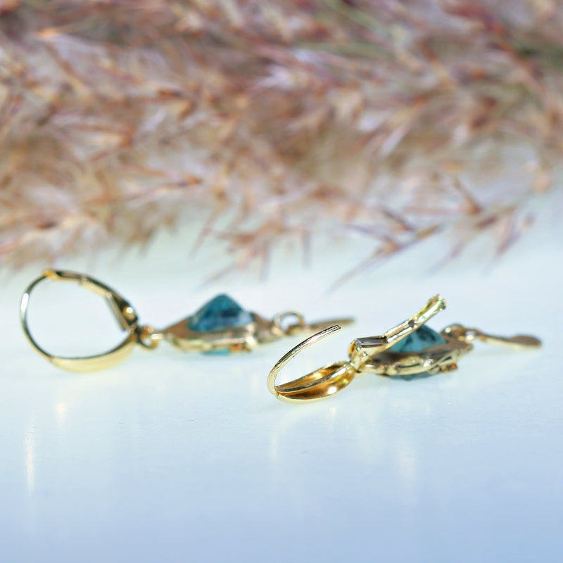 Gold earrings with sky blue tourmalines