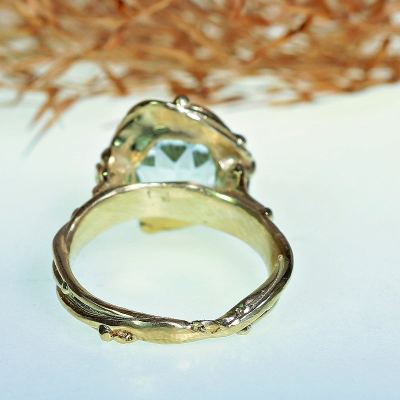 Gold ring with aquamarine in mandala cut