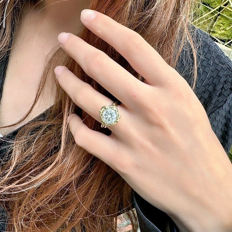 Gold ring with aquamarine in mandala cut