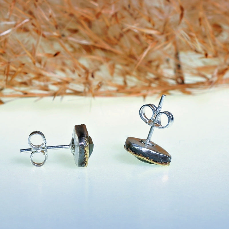 Stud earrings with green geo cut tourmalines