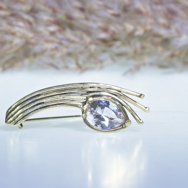 Gold brooch with danburite