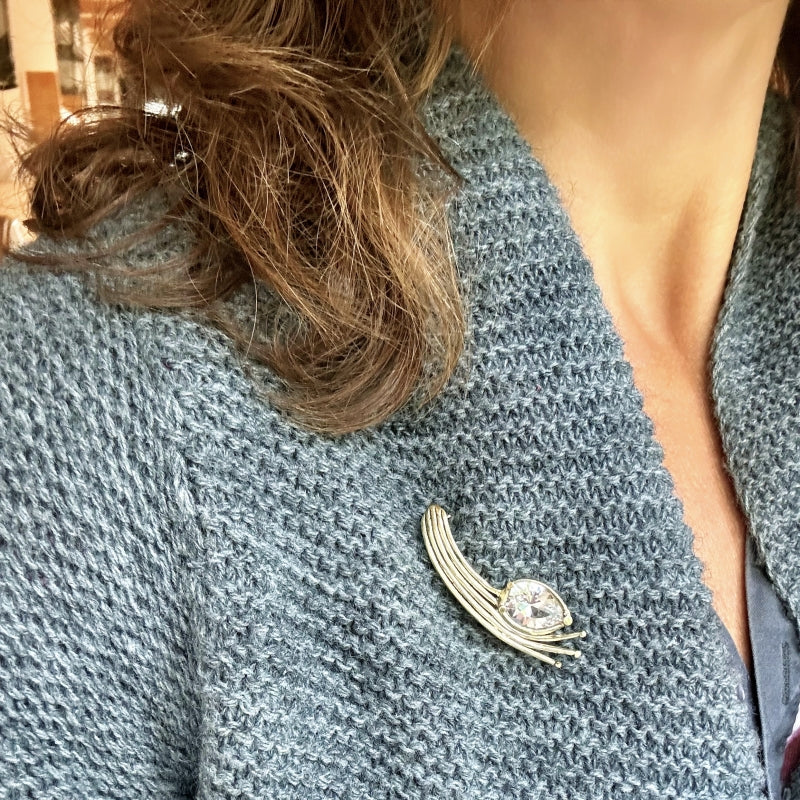 Gold brooch with danburite