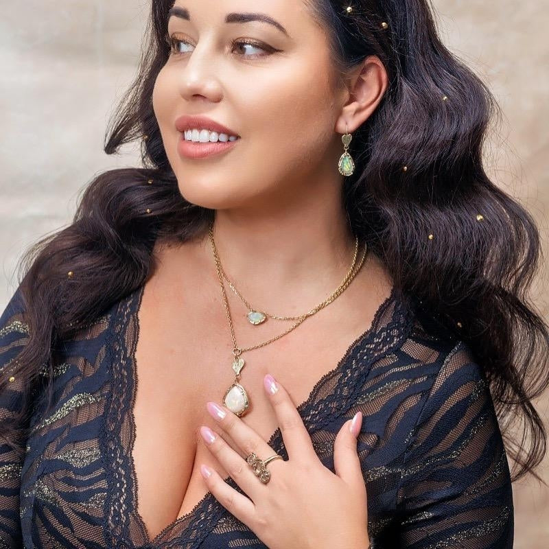 Gold earrings with opals and hearts