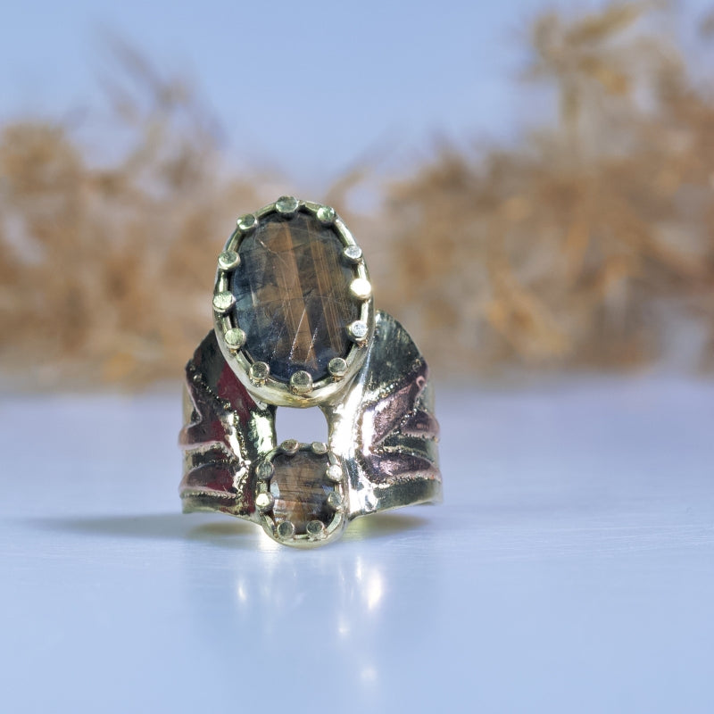 Wide gold ring with Gold Sheen sapphire
