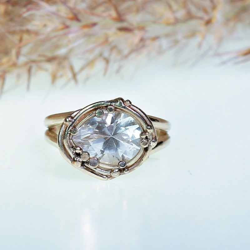 White gold ring with pear shape danburite