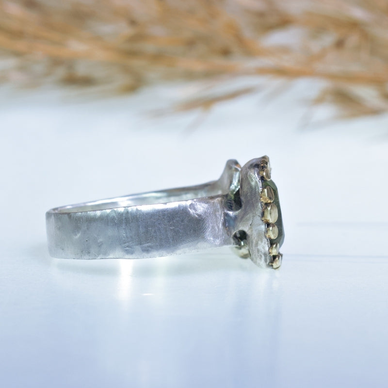 Ring with rutile peridot and silver heart