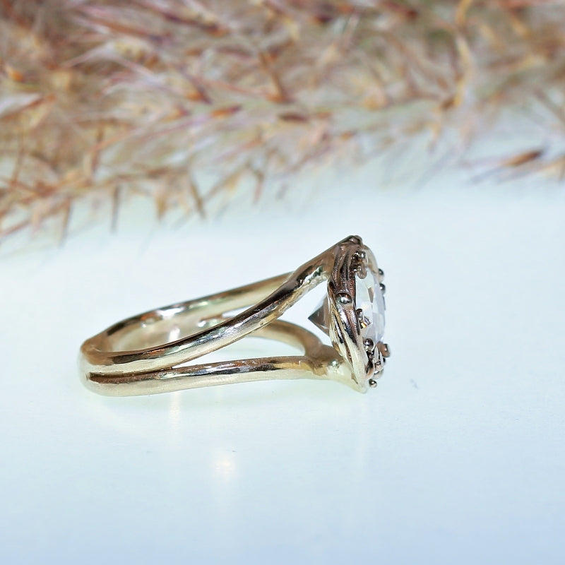 White gold ring with pear shape danburite