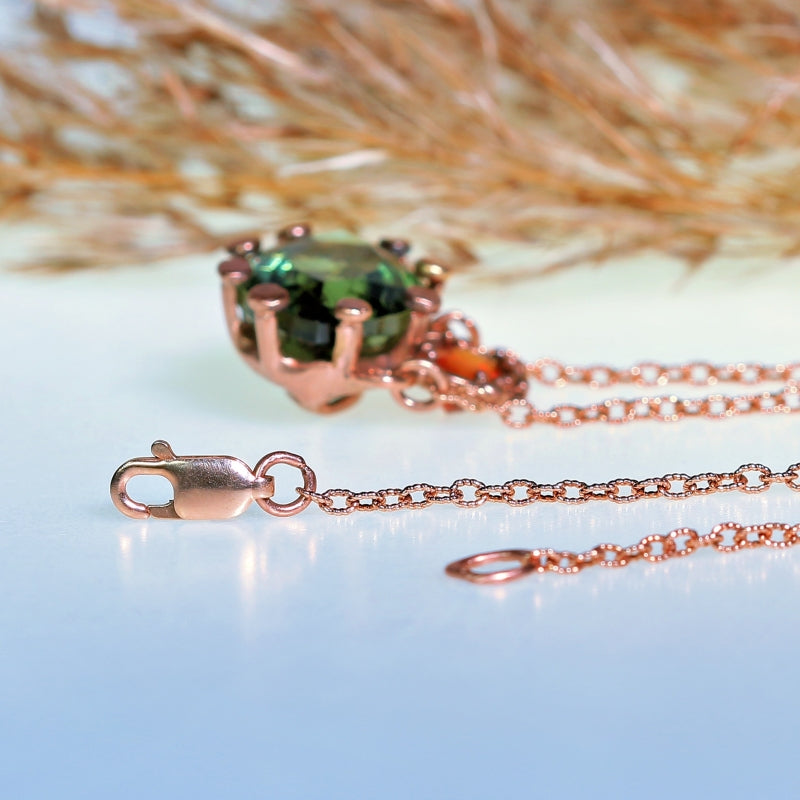 Gold necklace with moldavit and orange Umba sapphire