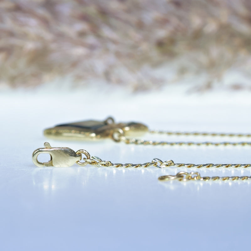 Gold necklace with two geometric sapphire