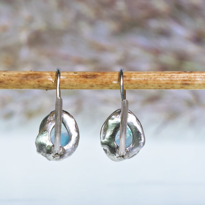 White gold earrings with gem silica