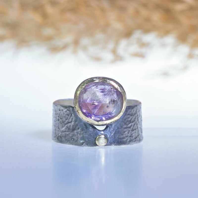 Ring with rutile amethyst and wide band