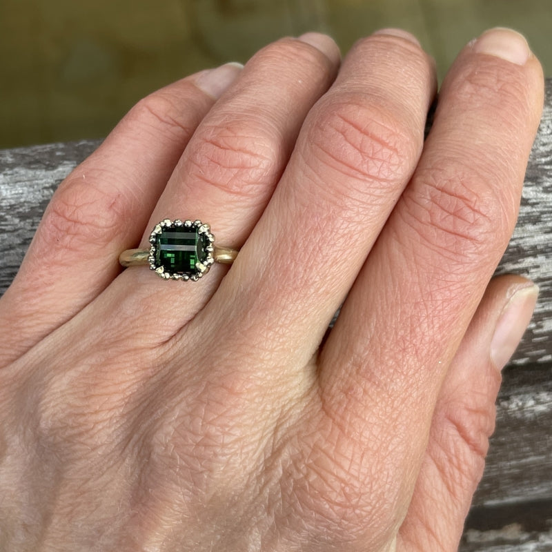 Gold ring with pixel cut tourmaline and halo