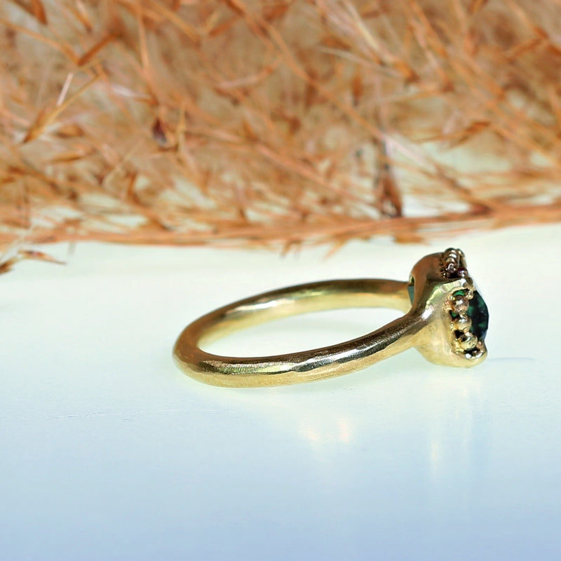 Gold ring with pixel cut tourmaline and halo