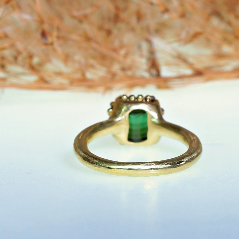 Gold ring with pixel cut tourmaline and halo