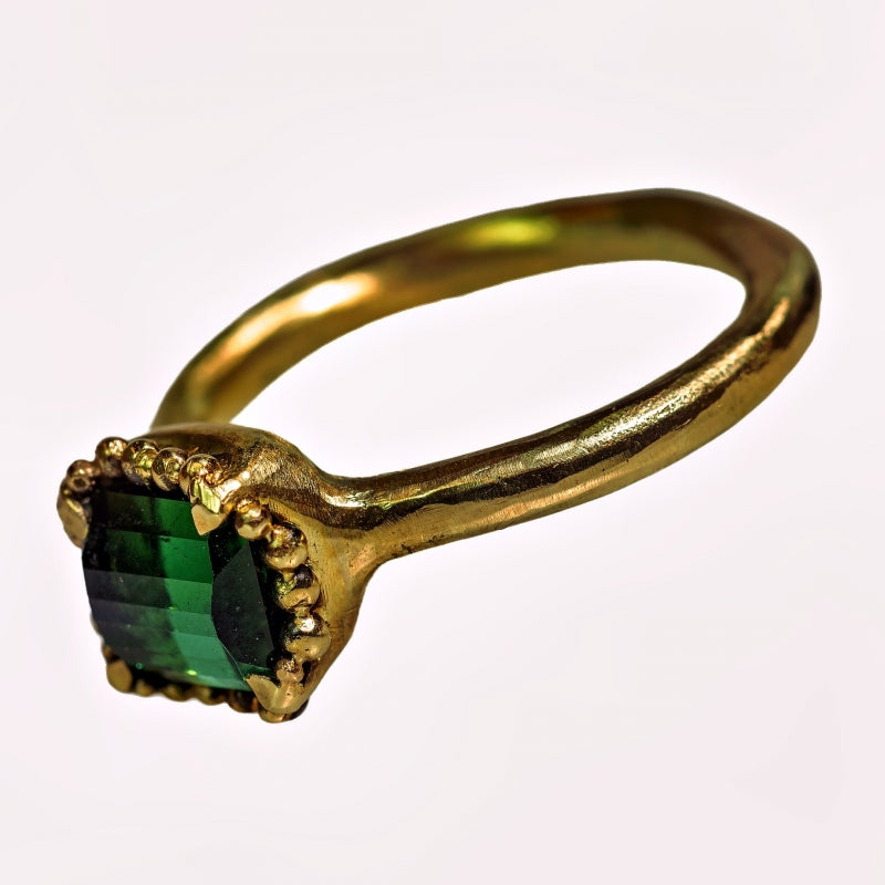 Gold ring with pixel cut tourmaline and halo