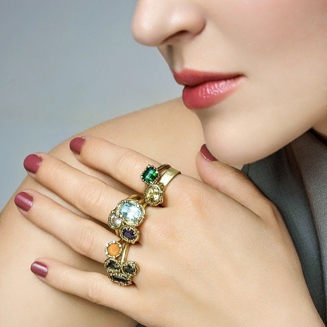 Gold ring with pixel cut tourmaline and halo