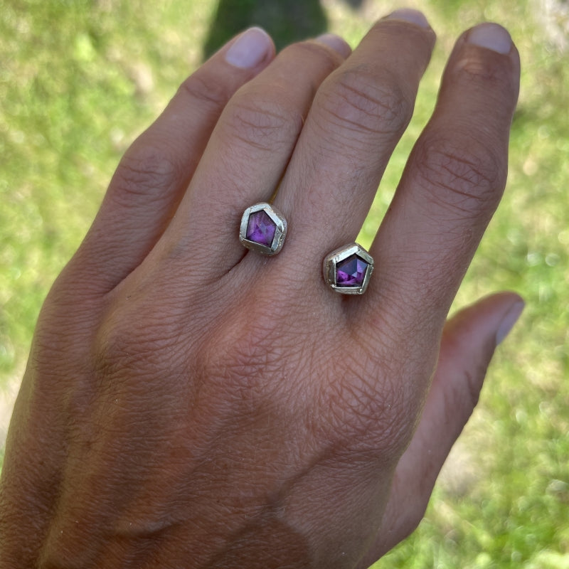 Open shape ring with two rhodolites garnets and gold lines
