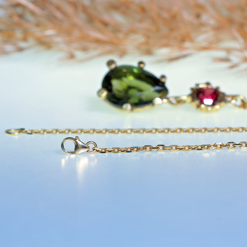 Gold necklace with moldavite and Umbalite garnet