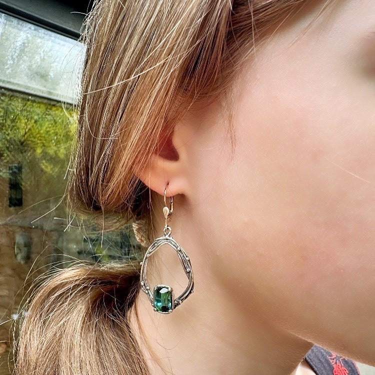 White gold earrings with blue-green tourmaline