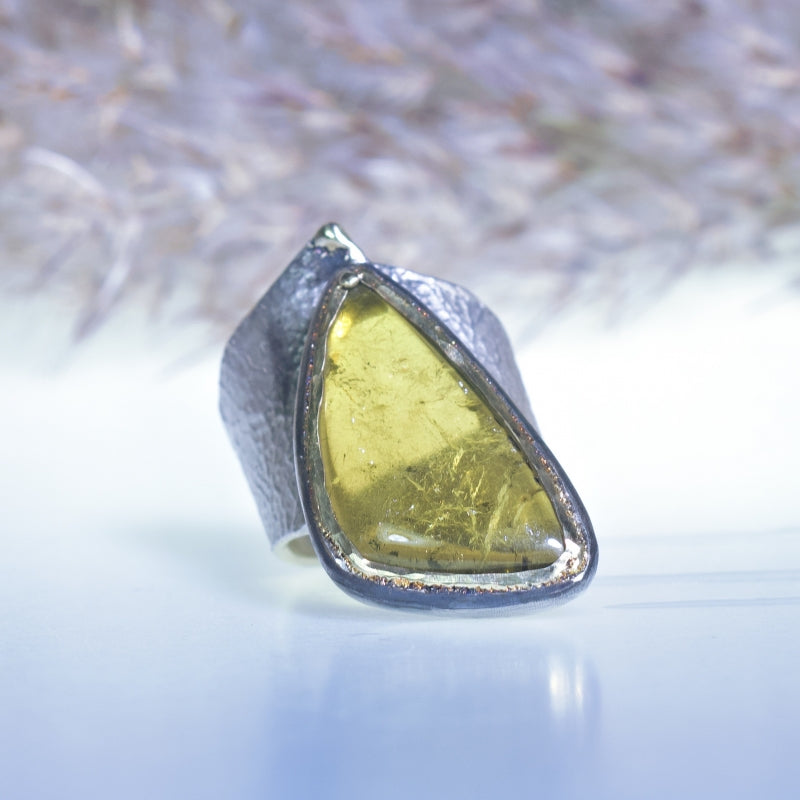 Wide ring with big green-yellow tourmaline