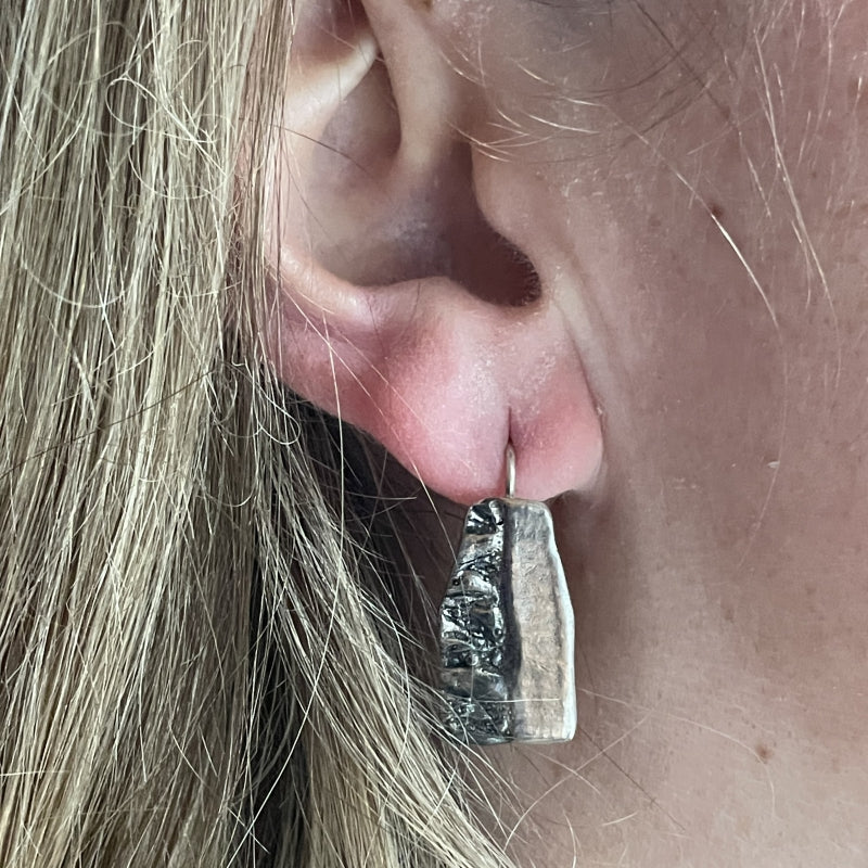 Hanging earrigns Earth and Sun