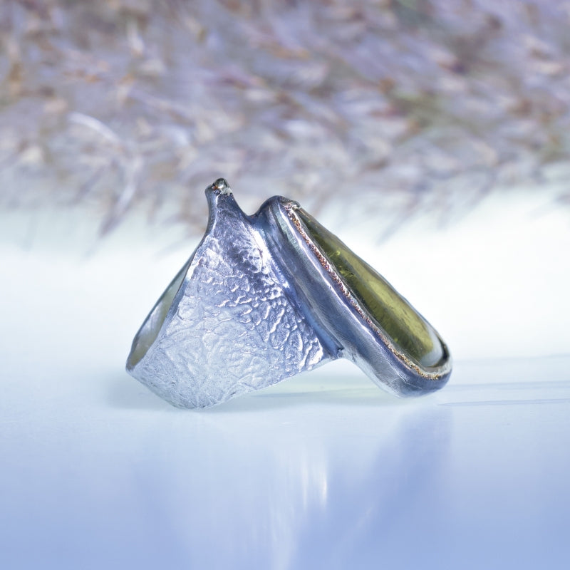 Wide ring with big green-yellow tourmaline