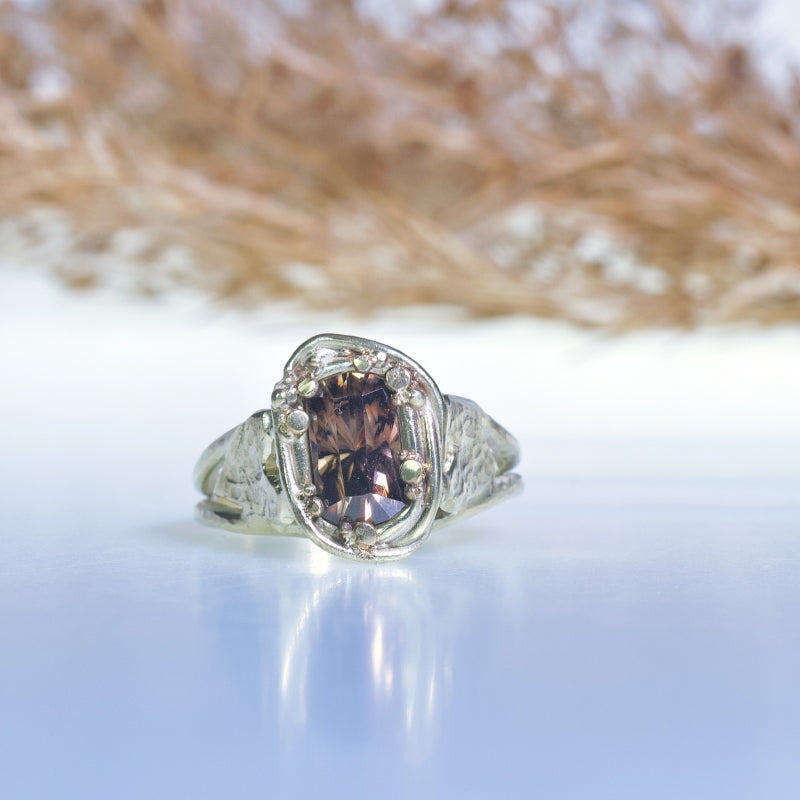 Gold ring with brown zircon and hearts