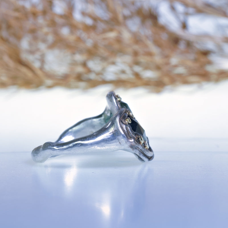 Open shape ring with two teal tourmalines