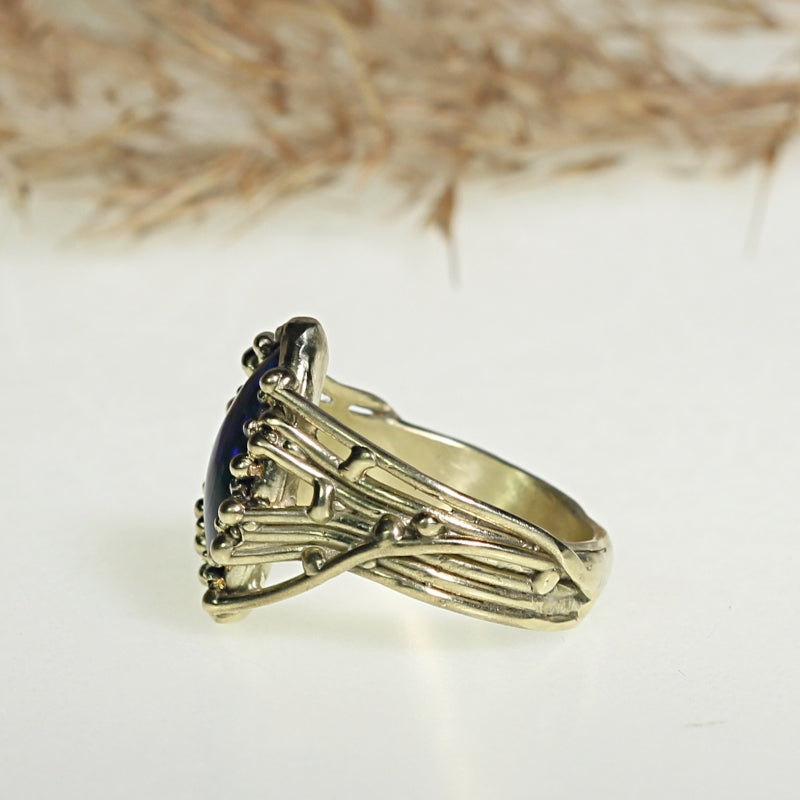 Gold ring Galaxy with dark blue opal