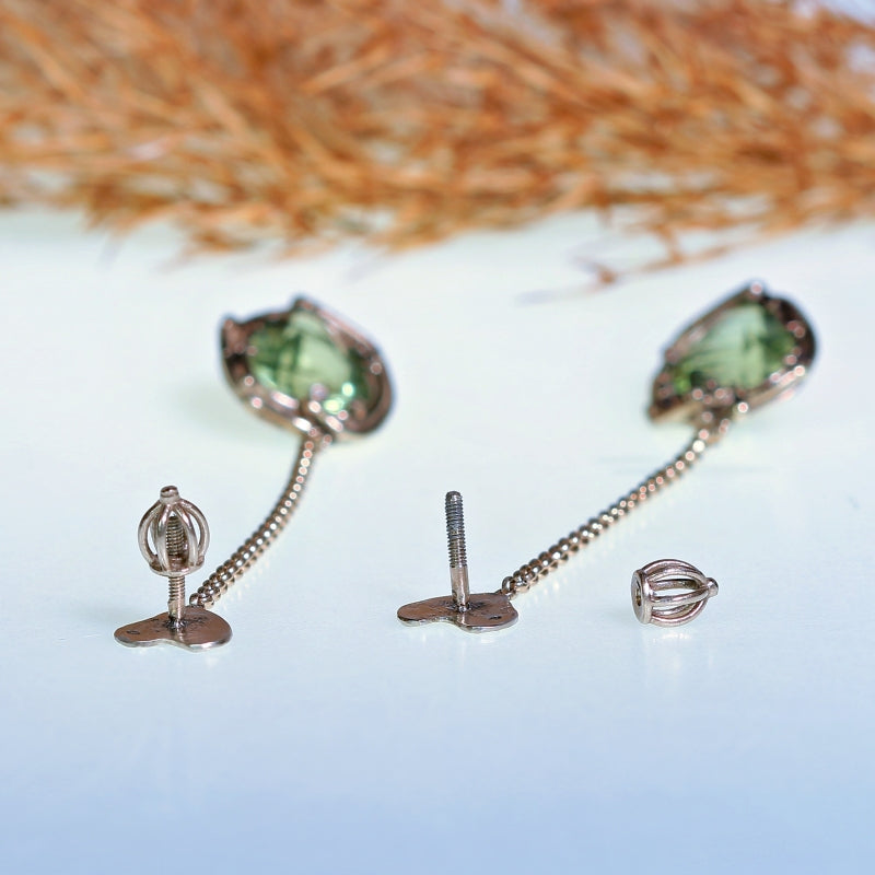 White gold long earrings with peridots