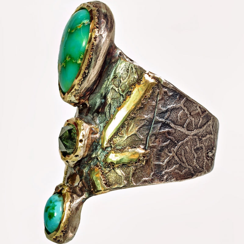 Wide ring with turquoises and sapphire